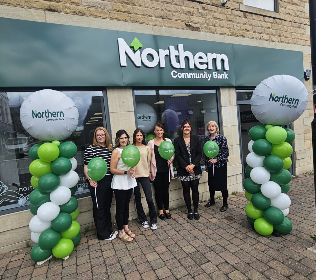 Staff outside the new Northern Community Bank in Colne